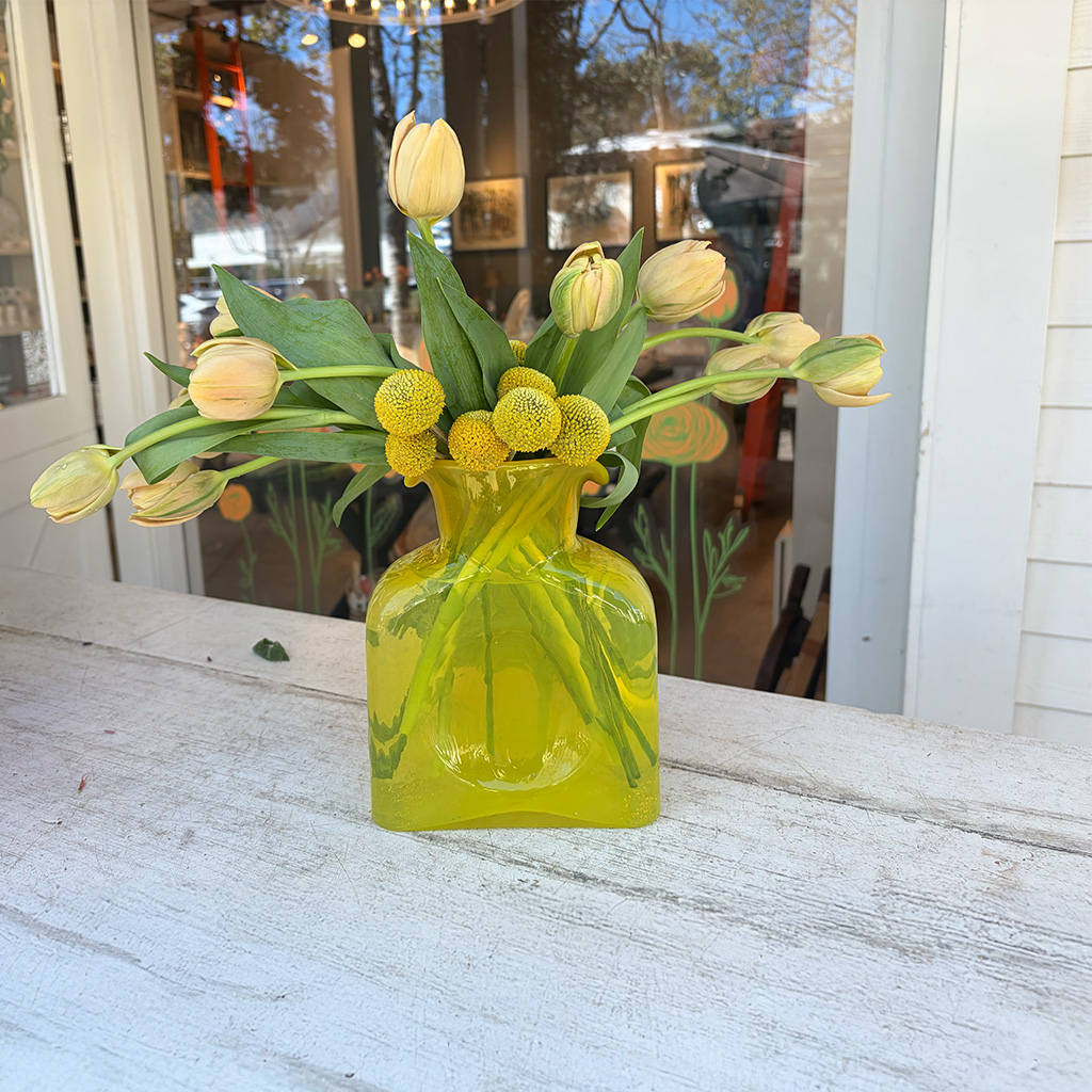 Floral centerpiece with vibrant seasonal blooms by Wild Beauty Floral Design