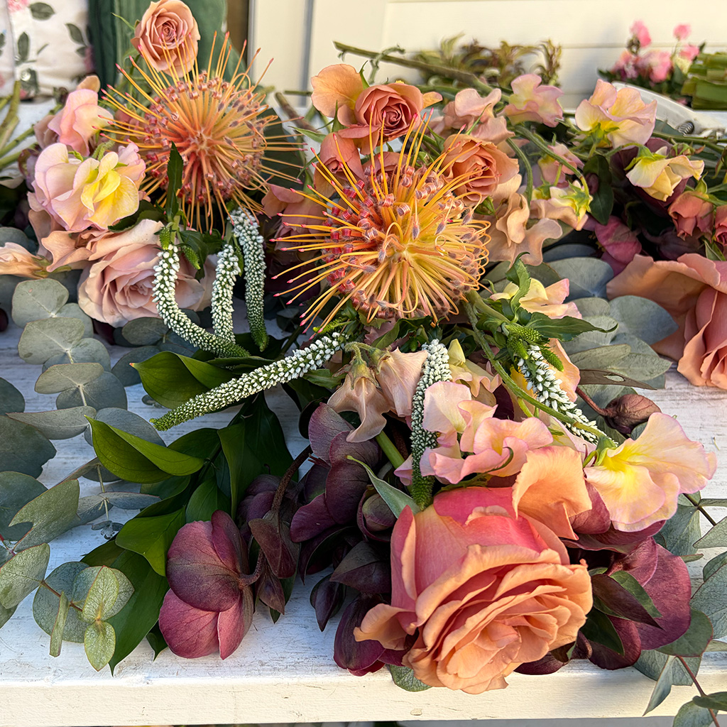 Moody, sculptural arrangement with depth by Wild Beauty Floral Design